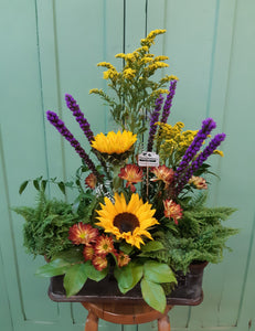 Arrangement floral chaleureux avec Tournesols