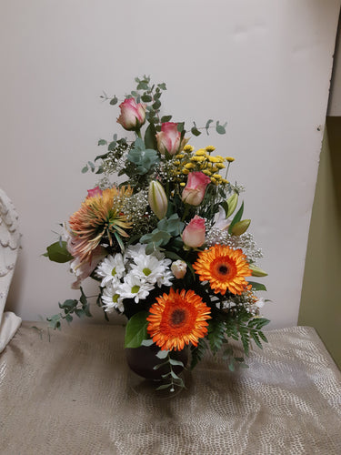 Bouquet dans les tons d'orange et rose