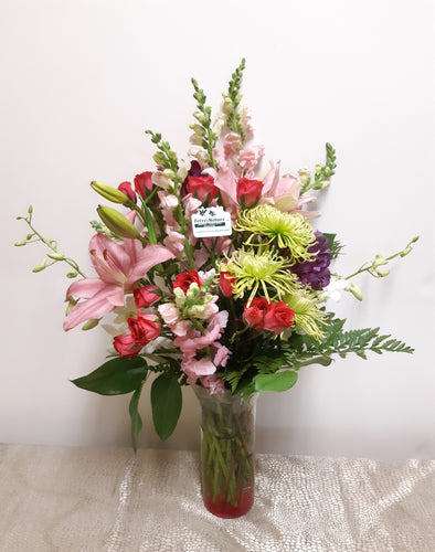Bouquet allongé avec Lys et Roses dans les tons de rose